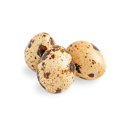 Group of three small whole uncooked raw quail eggs with shell of beige colour and brown spots and speckles isolated on white background used as healthy food ingredient in culinary full of protein