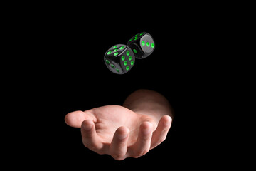 Man throwing dice on black background, closeup