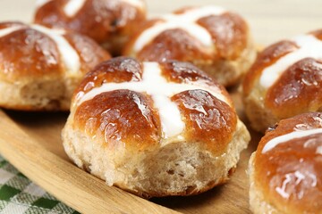 Tasty hot cross buns on table, closeup