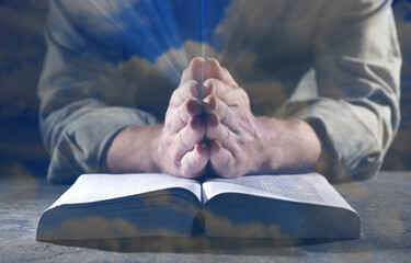 Religion. Double exposure of sky and Christian man praying over Bible at table, closeup