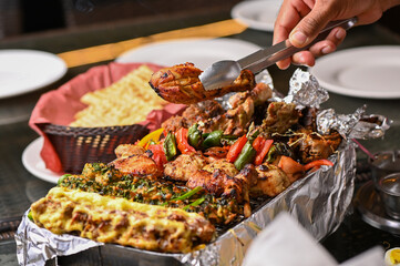 Grilled spicy meat kabab topped with chillis, Pakistani and Indian desi food