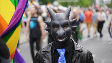Pup play bdsm mask. Black latex dragon suit. Bi man wear cosplay costume. Dressed up guy enjoy gay...