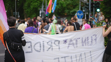 Lot of people hold wave lgbt banner. No homophobia poster. Many bi girl coming out party. Same sex...