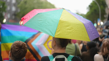 Hold cool colorful rainbow umbrella. No stop homophobia. Bi guy enjoy gay pride party. Lots of people have fun coming out fest. Joy csd love month parade. Parasols rainy day. Rain weather lgbt symbol.