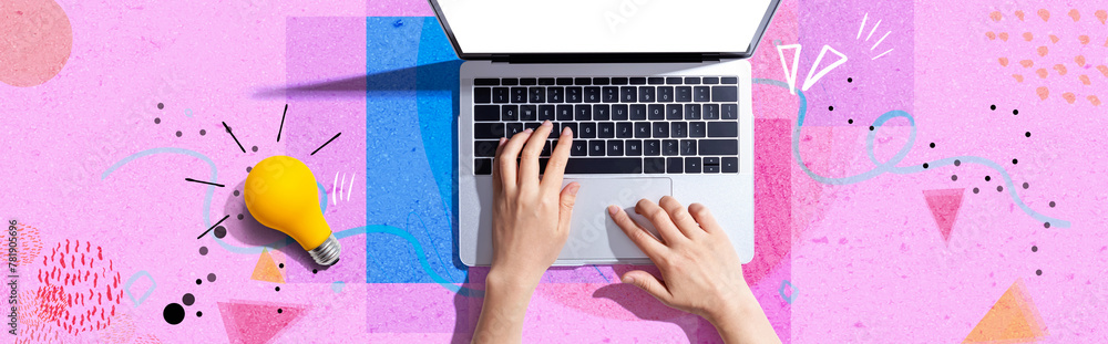 Sticker person using a laptop computer and a light bulb - flat lay