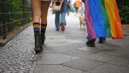 Bi people wear rainbow lgbt socks close up. Same sex love concept. Cool men have fun gay pride. Csd fest day symbol. Happy guy dance joy party city street. Queer girl coming out. Lgbtq sign closeup.