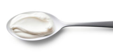 Spoon with delicious sour cream isolated on white background, top view