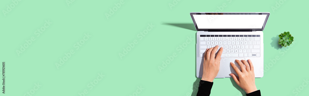 Sticker person using a laptop computer from above