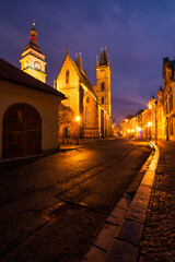 A magical winter night in the center of the city of Hradec Králové with the light of street lamps...