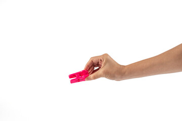 Close up of clothes peg in hand on white background