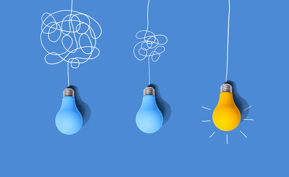 Clarifying complex ideas through the glow of lightbulbs - Flat lay