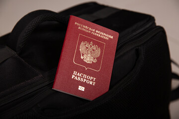 Close up of a Russian passport in a black travel bag pocket
