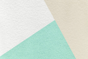 Texture of craft white, beige and cyan paper background, macro. Vintage abstract pastel cardboard