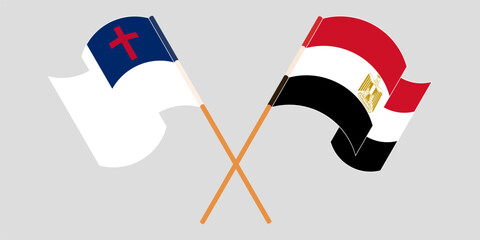 Crossed and waving flags of christianity and Egypt
