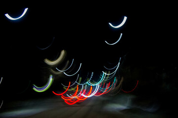 abstract light trails on the road in the city at night