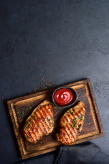 Grilled spicy chicken breasts. Top view with copy space. - 781939881