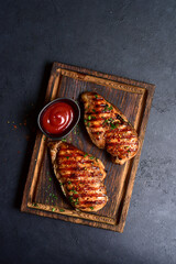 Grilled spicy chicken breasts. Top view with copy space. - 781940476