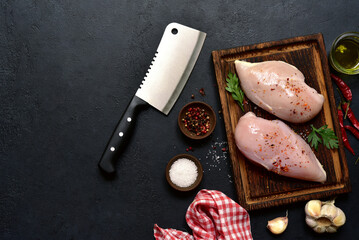 Raw chicken fillet or breasts with ingredients for cooking. Top view with copy space. - 781940841