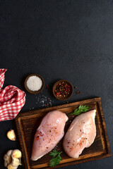 Raw chicken fillet or breasts with ingredients for cooking. Top view with copy space. - 781941004