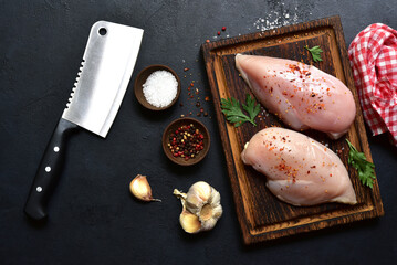 Raw chicken fillet or breasts with ingredients for cooking. Top view with copy space. - 781941081