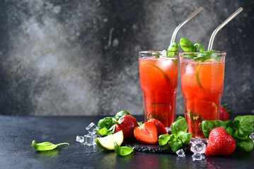 Cold summer strawberry cocktail with lime and basil in a  glasses . - 781941805