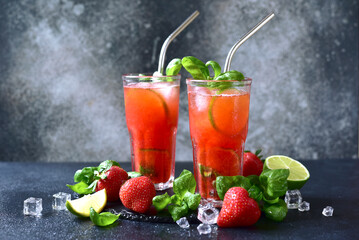 Cold summer strawberry cocktail with lime and basil in a  glasses . - 781942029