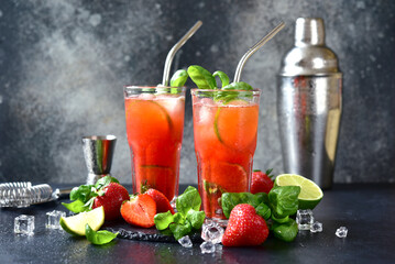 Cold summer strawberry cocktail with lime and basil in a  glasses . - 781942051