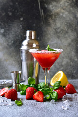 Cold summer strawberry cocktail with lemon and basil in a  martini  glasses . - 781942274