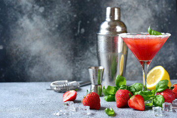 Cold summer strawberry cocktail with lemon and basil in a  martini  glasses . - 781942435