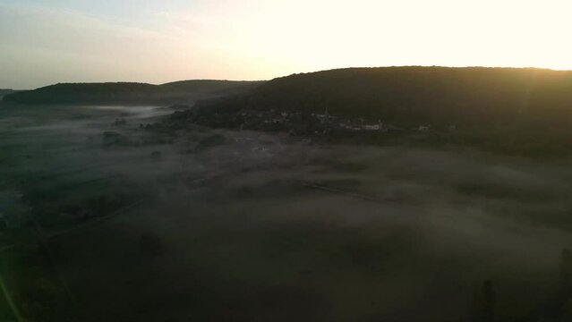 Aerial View of Bouguignon les Moray a small Village in Bourgogne France Early Morning with mist and Sunrise . High quality 4k footage