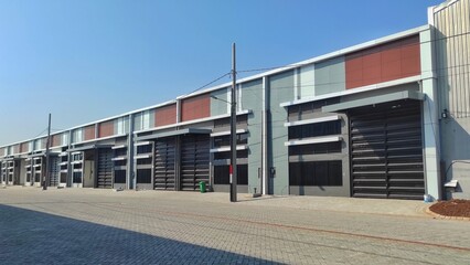 Fototapeta na wymiar A block of empty warehouse ready for sale in urban area
