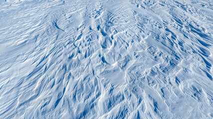 the texture of snow in the tundra from the top