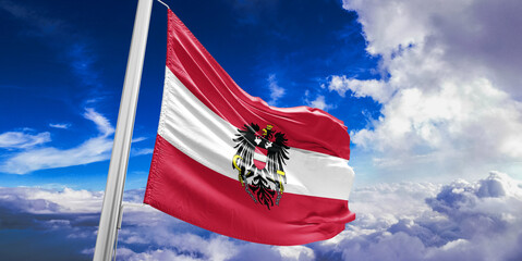 Austria national flag cloth fabric waving on beautiful Blue Sky Background.