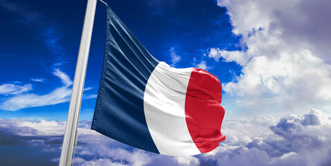 France national flag cloth fabric waving on beautiful Blue Sky Background.
