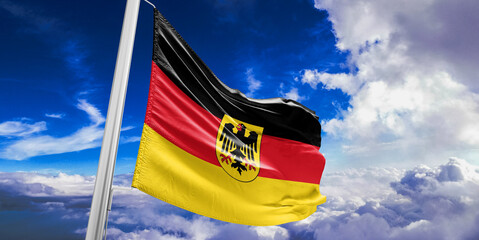 Germany national flag cloth fabric waving on beautiful Blue Sky Background.