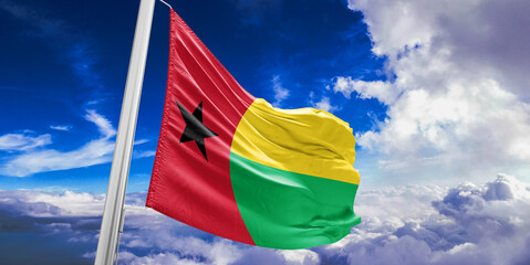 Guinea-Bissau national flag cloth fabric waving on beautiful Blue Sky Background.