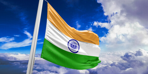 India national flag cloth fabric waving on beautiful Blue Sky Background.