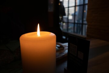 Beautiful closeup of a candle in the dark