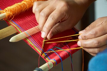Tourist learning back strap weaving in Guatemala