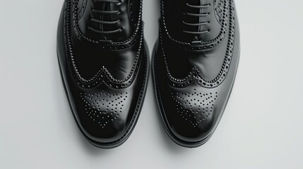 close-up Men's black shoes against a white backdrop.