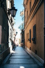 Narrow street between old buildings in Warsaw