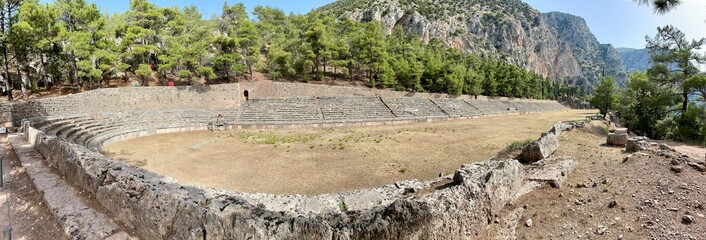 Panoramic shot of ancient stadium at Delphi, Greece © Wirestock