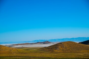 Scenic view of hills at Lake Urmia in Iran under a cloudless blue sky on a sunny day