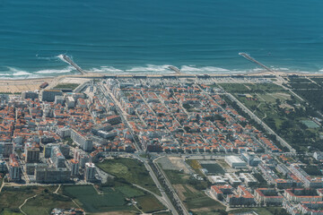 The Aerial footage of Costa da Caparica coastline of glorious sandy beaches, powerful Atlantic...