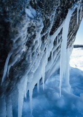 Closeup of icicles on a stone