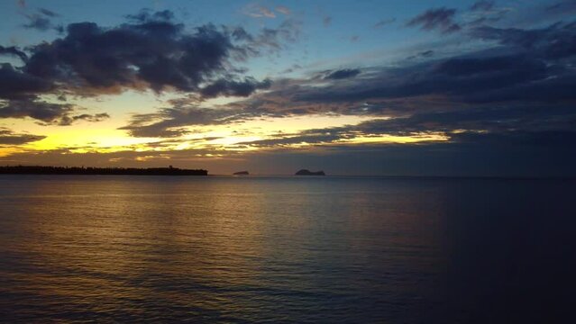 Aerial time lapse video of a beautiful sunset at Pasir Pandak beach, Santubong Sarawak, Malaysia