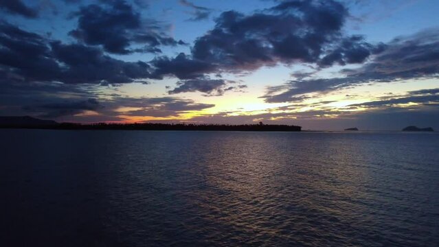 Aerial video of a beautiful sunset at Pasir Pandak beach, Santubong Sarawak, Malaysia