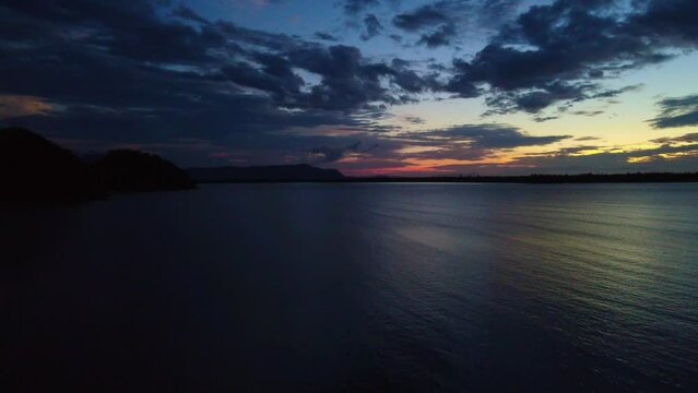 Aerial video of a beautiful sunset at Pasir Pandak beach, Santubong Sarawak, Malaysia