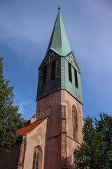 Fototapeta na wymiar Vertical shot of St. Peter's Protestant church under blue sky in Heidelberg, Germany