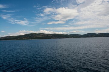 Beautiful shot of the blue sea during cruise from Amaliapoli to Skiathos islands in Greece